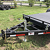 Black 2026 Rainbow Trailers 20' Excursion Tilt Deck Trailer
