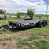 Black 2026 Rainbow Trailers 20' Excursion Tilt Deck Trailer