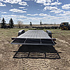 Black 2026 Rainbow Trailers 22' Excursion Tilt Deck Trailer