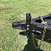 Black 2026 Rainbow Trailers 18' Excursion Tilt Deck Trailer