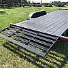 Black 2026 Rainbow Trailers 18' Excursion Tilt Deck Trailer