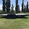Black 2026 Rainbow Trailers 18' Excursion Tilt Deck Trailer