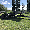 Black 2026 Rainbow Trailers 18' Excursion Tilt Deck Trailer