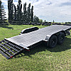 Black 2026 Rainbow Trailers 18' Excursion Tilt Deck Trailer