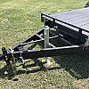 Black 2026 Rainbow Trailers 20' Excursion Tilt Deck Trailer