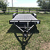 Black 2026 Rainbow Trailers 20' Excursion Tilt Deck Trailer
