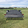 Black 2026 Rainbow Trailers 20' Excursion Tilt Deck Trailer
