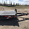 Black 2026 Rainbow Trailers 22' Excursion Tilt Deck Trailer