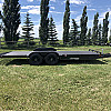 Black 2026 Rainbow Trailers 20' Excursion Tilt Deck Trailer