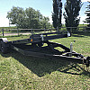 Black 2026 Rainbow Trailers 20' Excursion Tilt Deck Trailer