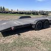 Black 2026 Rainbow Trailers 20' Excursion Tilt Deck Trailer
