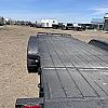 Black 2027 Rainbow Trailers 18' Excursion Tilt Deck Trailer