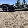Black 2027 Rainbow Trailers 18' Excursion Tilt Deck Trailer