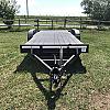 Black 2026 Rainbow Trailers 20' Excursion Tilt Deck Trailer