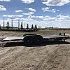 Black 2027 Rainbow Trailers 22' Excursion Tilt Deck Trailer