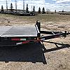 Black 2027 Rainbow Trailers 22' Excursion Tilt Deck Trailer