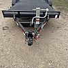 Black 2027 Rainbow Trailers 20' Excursion Tilt Deck Trailer 2x7000 lb Axles at FM Trailer World