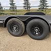 Black 2027 Rainbow Trailers 20' Excursion Tilt Deck Trailer 2x7000 lb Axles at FM Trailer World