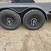 Black 2027 Rainbow Trailers 22' Excursion Tilt Deck Trailer 2x7000 lb Axles at FM Trailer World