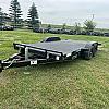 Black 2027 Rainbow Trailers 18' Excursion Tilt Deck Trailer 2x5,200 lb Axles at FM Trailer World