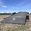 Black 2027 Rainbow Trailers 18' Excursion Tilt Deck Trailer 2x5,200 lb Axles at FM Trailer World