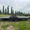Black 2027 Rainbow Trailers 18' Excursion Tilt Deck Trailer 2x5,200 lb Axles at FM Trailer World