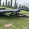 Black 2027 Rainbow Trailers 18' Excursion Tilt Deck Trailer 2x5,200 lb Axles at FM Trailer World