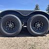 Black 2027 Rainbow Trailers 18' Excursion Tilt Deck Trailer 2x5,200 lb Axles at FM Trailer World
