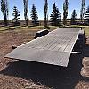 Black 2027 Rainbow Trailers 22' Excursion Tilt Deck Trailer 2x5200 lb Axles at FM Trailer World