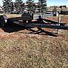 Black 2027 Rainbow Trailers 22' Excursion Tilt Deck Trailer 2x5200 lb Axles at FM Trailer World
